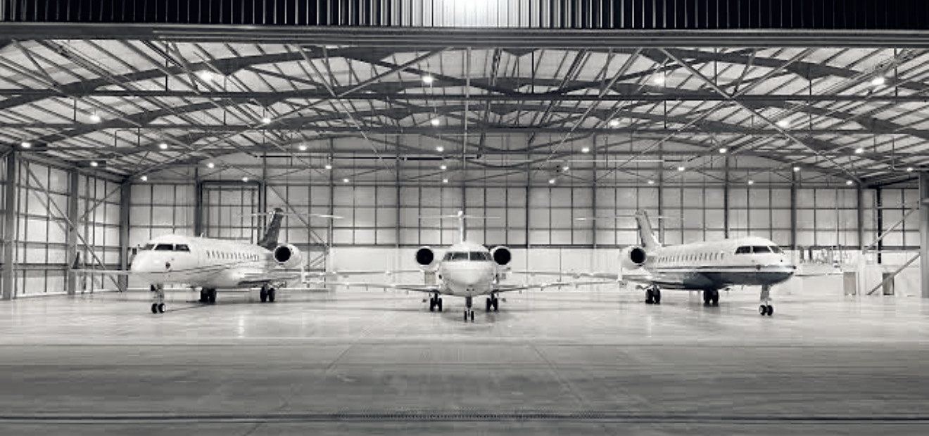 Business aircraft inside a maintenance hangar